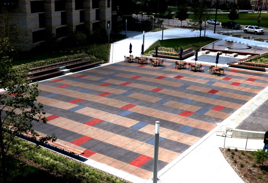 Lenexa civic center with decorative concrete outside of the building featuring red and blue