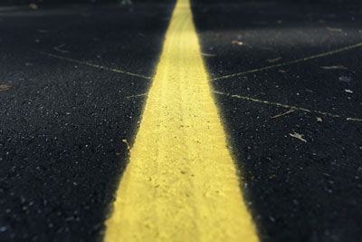 painted line on asphalt pavement