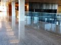 decorative concrete flooring featuring glass railing