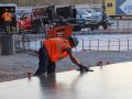 concrete contractor smoothing out structural concrete
