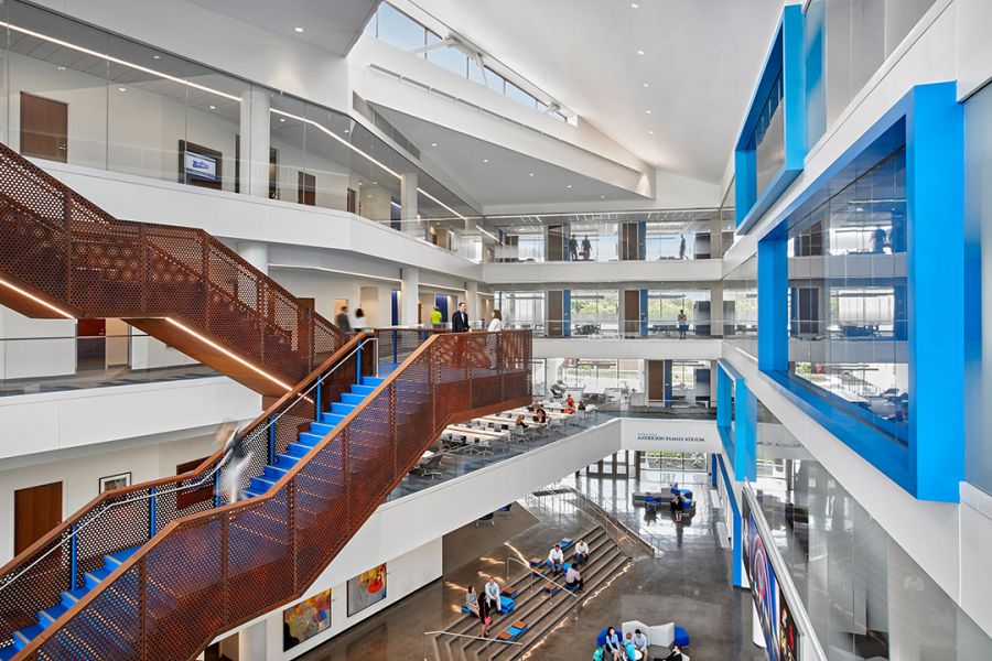 KU school of business featuring lots of windows, decorative concrete, and accents of blue