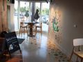 decorative concrete featuring colorful drawings on the floor and walls