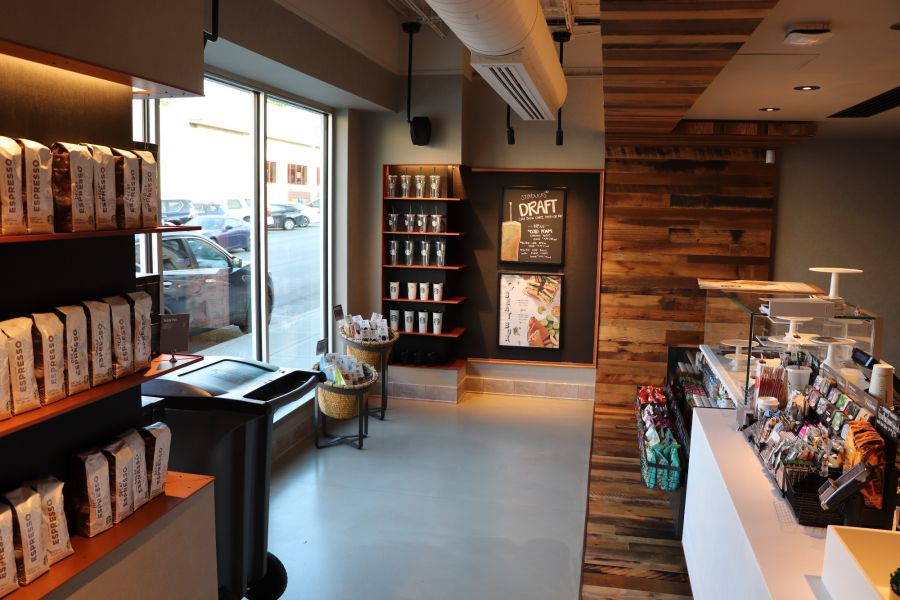 interior of starbucks featuring decorative concrete and wood accents