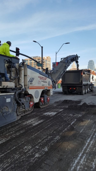 asphalt contractors reconstructing 20th street near the Crossroads District