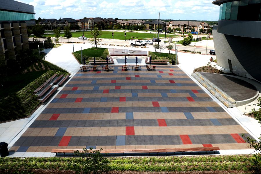 Lenexa Civic Center outdoor area featuring a stage and seating area made of decorative concrete
