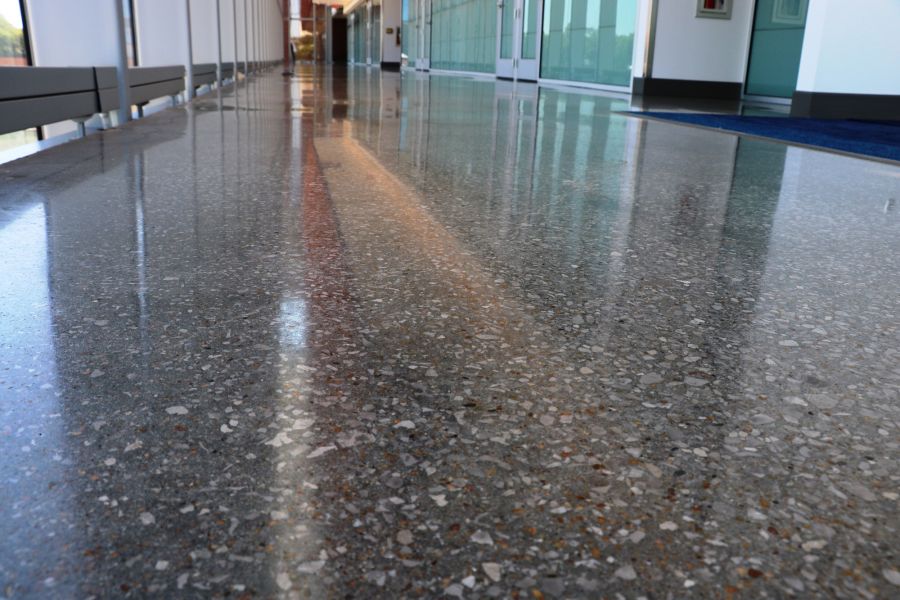 an up close image of the speckled decorative concrete flooring inside KU's Health Building