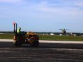 asphalt roller compacting the asphalt paving at the New Century Airport