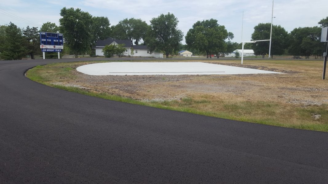 freshly laid asphalt pavement at Wellsville High School track