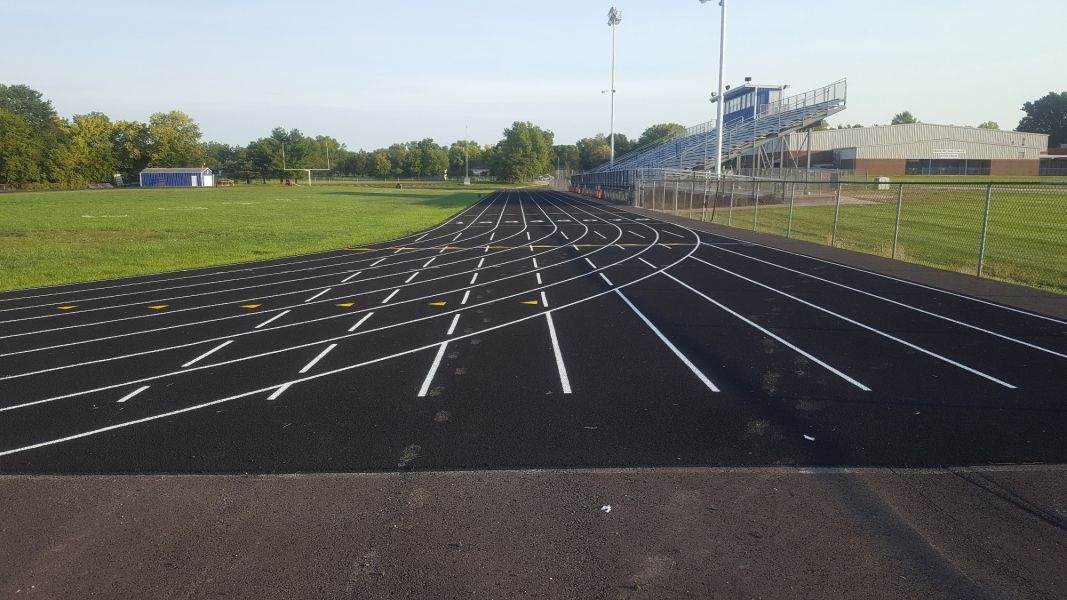 Wellsville High School Track with stadium seats to the right of the track