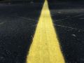 freshly painted yellow parking lot line